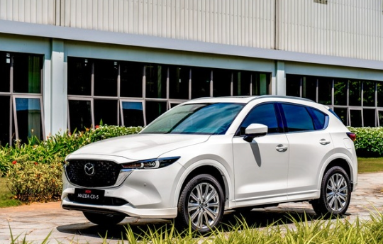 21-1774064285-mazda-cx-5-2026-den-nguoc-ngay-ve-viet-nam-ruc-rich-them-ban-off-road-de-net-hyundai-tucson