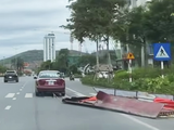 Quảng Ninh: Triệu tập tài xế ô tô kéo lê tấm tôn giữa đường